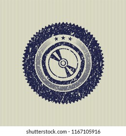 Blue CD or DVD disc icon inside grunge stamp