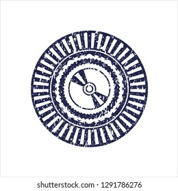 Blue CD or DVD disc icon inside distress rubber seal