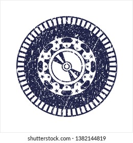 Blue CD or DVD disc icon inside distress rubber seal