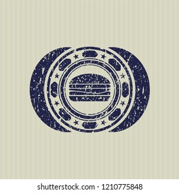 Blue cheeseburger icon inside distressed rubber seal with grunge texture