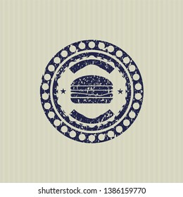 Blue cheeseburger icon inside rubber seal with grunge texture