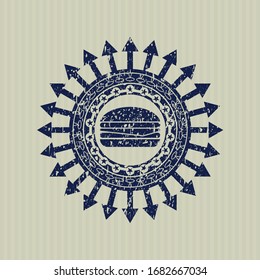 Icono azul del émbolo de queso dentro del sello de textura grunge de goma