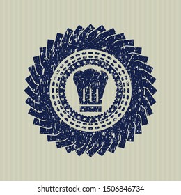 Blue chef hat icon inside distress rubber stamp