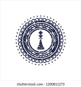 Blue chess king icon inside rubber grunge texture stamp
