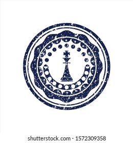 Blue chess king icon inside rubber grunge texture stamp