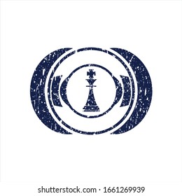 Blue chess king icon inside rubber grunge stamp