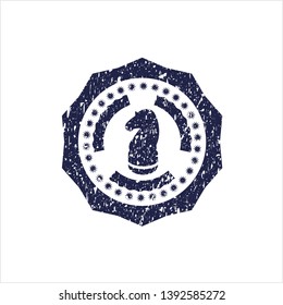 Blue chess knight icon inside distress rubber stamp