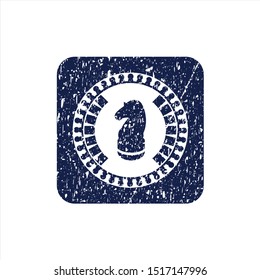 Blue chess knight icon inside distress rubber seal