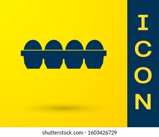 Blue Chicken egg in box icon isolated on yellow background.  Vector Illustration