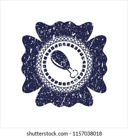 Blue chicken leg icon inside distressed rubber texture