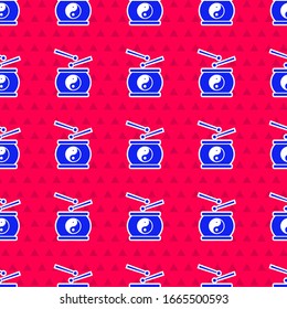Blue Chinese drum icon isolated seamless pattern on red background. Traditional asian percussion instrument Taiko or O-Daiko drum.  Vector Illustration