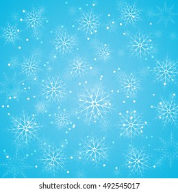 Blue Christmas background with falling snowflakes