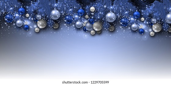 Blue Christmas background with fir twigs and balls. Xmas baubles.Vector illustration.