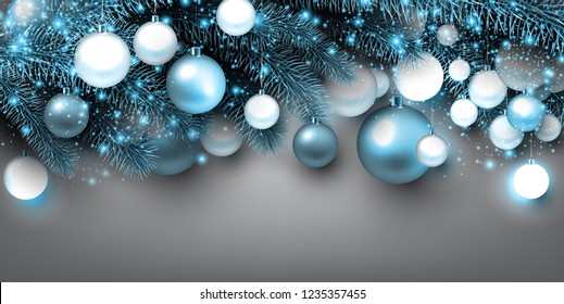 Blue Christmas background with fir twigs and balls. Xmas baubles.Vector illustration.