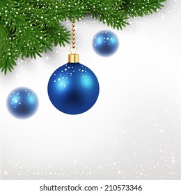 Blue christmas balls on fir tree with snowflakes