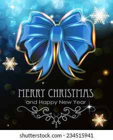 Blue Christmas bow on abstract background with sparkling lights