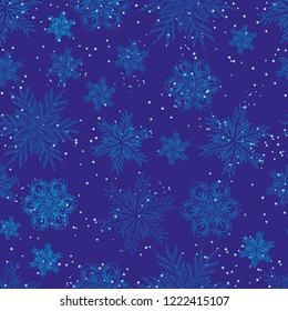 Blue Christmas seamless pattern of snowflakes. Christmas and New Year background. Vector illustration.