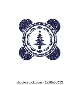 Blue christmas tree icon inside distressed grunge stamp