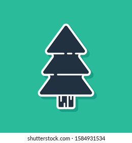 Blue Christmas tree icon isolated on green background. Merry Christmas and Happy New Year.  Vector Illustration