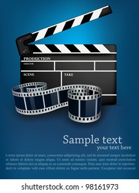 Blue cinema background with black movie clapper