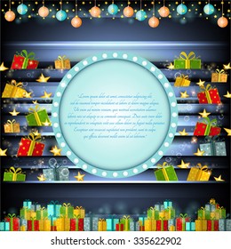 Blue circle frame on silver Christmas background with golden stars and present boxes 