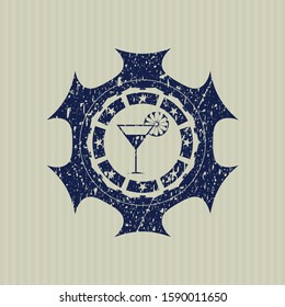 Blue cocktail glass icon inside rubber grunge stamp
