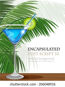 Blue cocktail with kiwi and ice cubes and palm branches on a bar counter