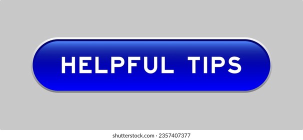 Blue color capsule shape button with word helpful tips  on gray background