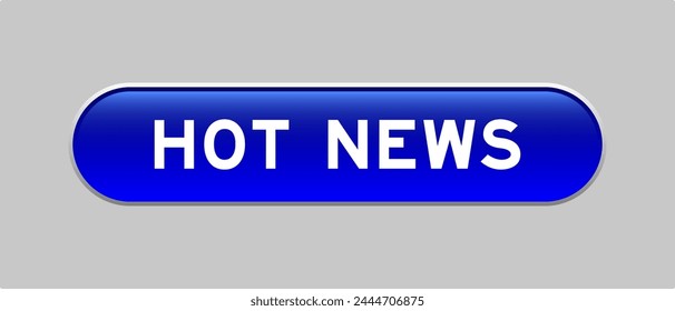 Blue color capsule shape button with word hot news on gray background