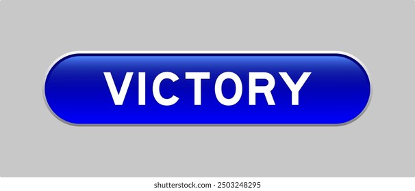 Blue color capsule shape button with word victory on gray background