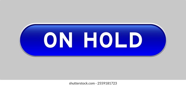 Blue color capsule shape button with word on hold on gray background