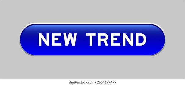 Blue color capsule shape button with word new trend on gray background