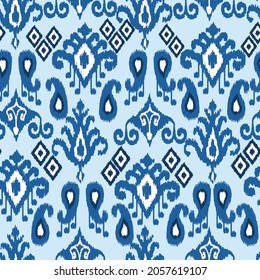 Blue color ikat pattern - traditional handmade silk fabric, producing in Margilan city, Uzbekistan. Oriental ornaments. Ferghana valley. Adras and atlas. 