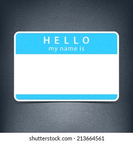 Blue color name tag blank sticker HELLO my name is. Rounded rectangular badge with black drop shadow on gray background with noise effect texture. Vector illustration design element 10 eps