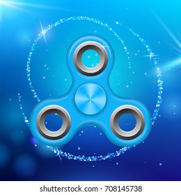 Blue colorful spinner on an abstract background with blue luminous backdrop. Abstract background with blue luminous backdrop. Modern children's toy - spinner.