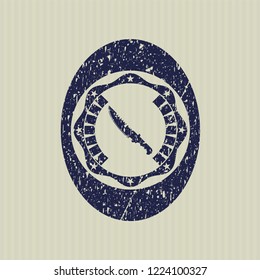 Blue combat knife icon inside distress grunge stamp
