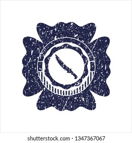 Blue combat knife icon inside distress rubber grunge seal