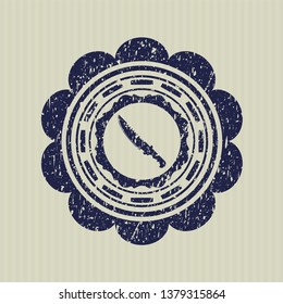 Blue combat knife icon inside distressed grunge seal