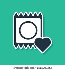 Blue Condom in package icon isolated on green background. Safe love symbol. Contraceptive method for male.  Vector Illustration