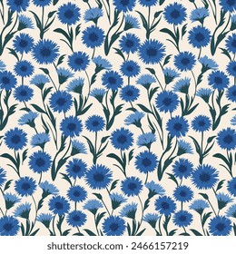 Blue cornflowers on a light background.Vector seamless pattern with blue cornflowers on a colored background.