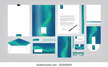 Blue corporate identity template. Vector company style for brand book and guideline. Folder, pen, envelope, business card, CD disc, flash memory card, pencil, ruler, glasses, and blank sheet.