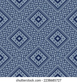 Blue cross stitch traditional ethnic pattern paisley flower Ikat background abstract Aztec African Indonesian Indian seamless pattern for fabric print cloth dress carpet curtains and sarong