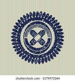 Blue crossed bandage plaster icon inside distress grunge stamp