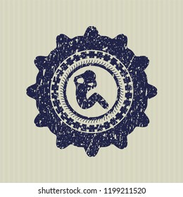 Blue crunch icon inside distress rubber seal with grunge texture