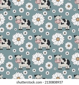 Blue cute seamless pattern with cows and chamomiles