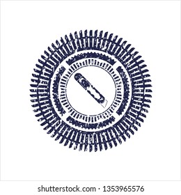 Blue cutter icon inside distress rubber stamp