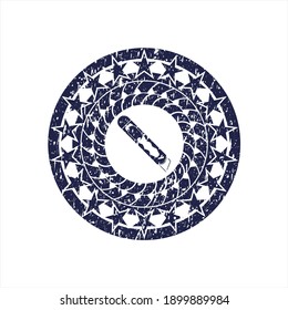 Blue cutter icon inside grunge stamp. 