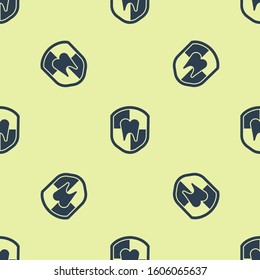 Blue Dental protection icon isolated seamless pattern on yellow background. Tooth on shield logo.  Vector Illustration