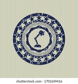 Blue desk lamp icon inside distress rubber grunge stamp