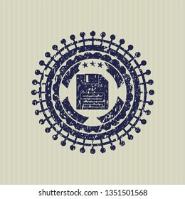 Blue diskette icon inside distress rubber grunge stamp